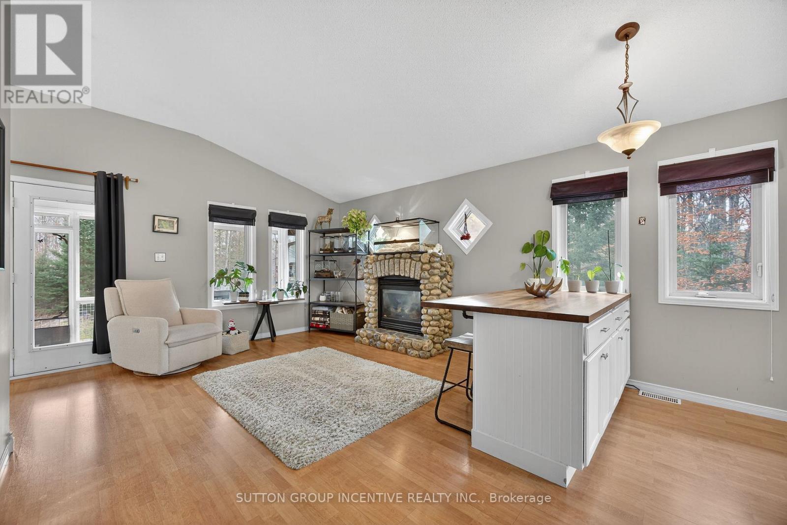 351 Chub Lake Road, Huntsville, ON - Indoor Photo Showing Living Room With Fireplace