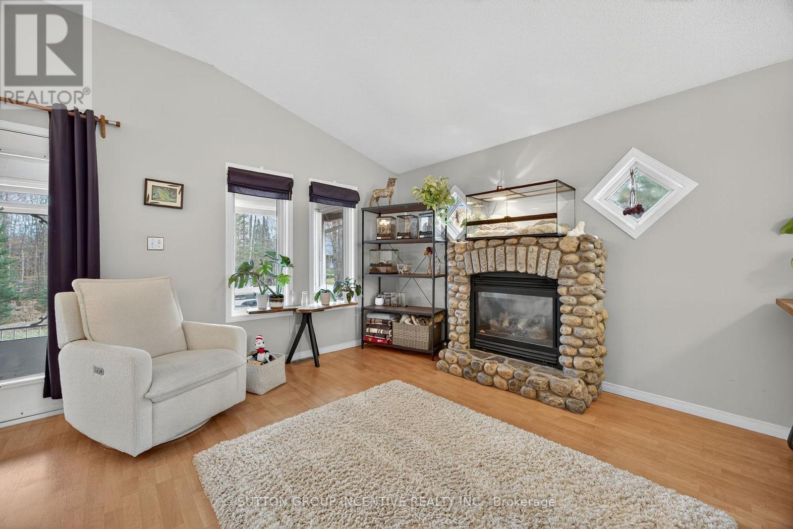 351 Chub Lake Road, Huntsville, ON - Indoor Photo Showing Living Room With Fireplace