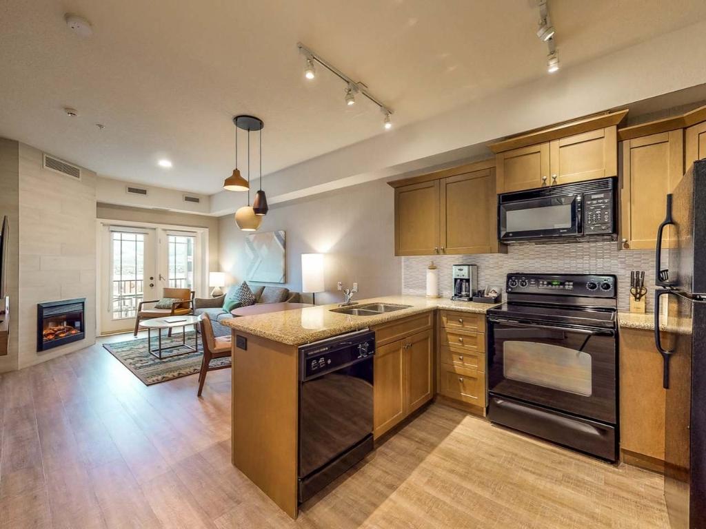 207A-1200 Rancher Creek Road, Osoyoos, BC - Indoor Photo Showing Kitchen With Fireplace With Double Sink