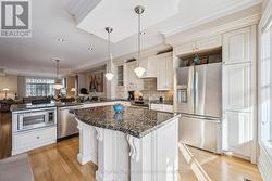 The Well-Appointed Kitchen Offers a Centre Island -