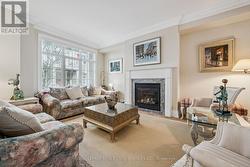 Living Area with Hardwood Flooring & Gas Fireplace -