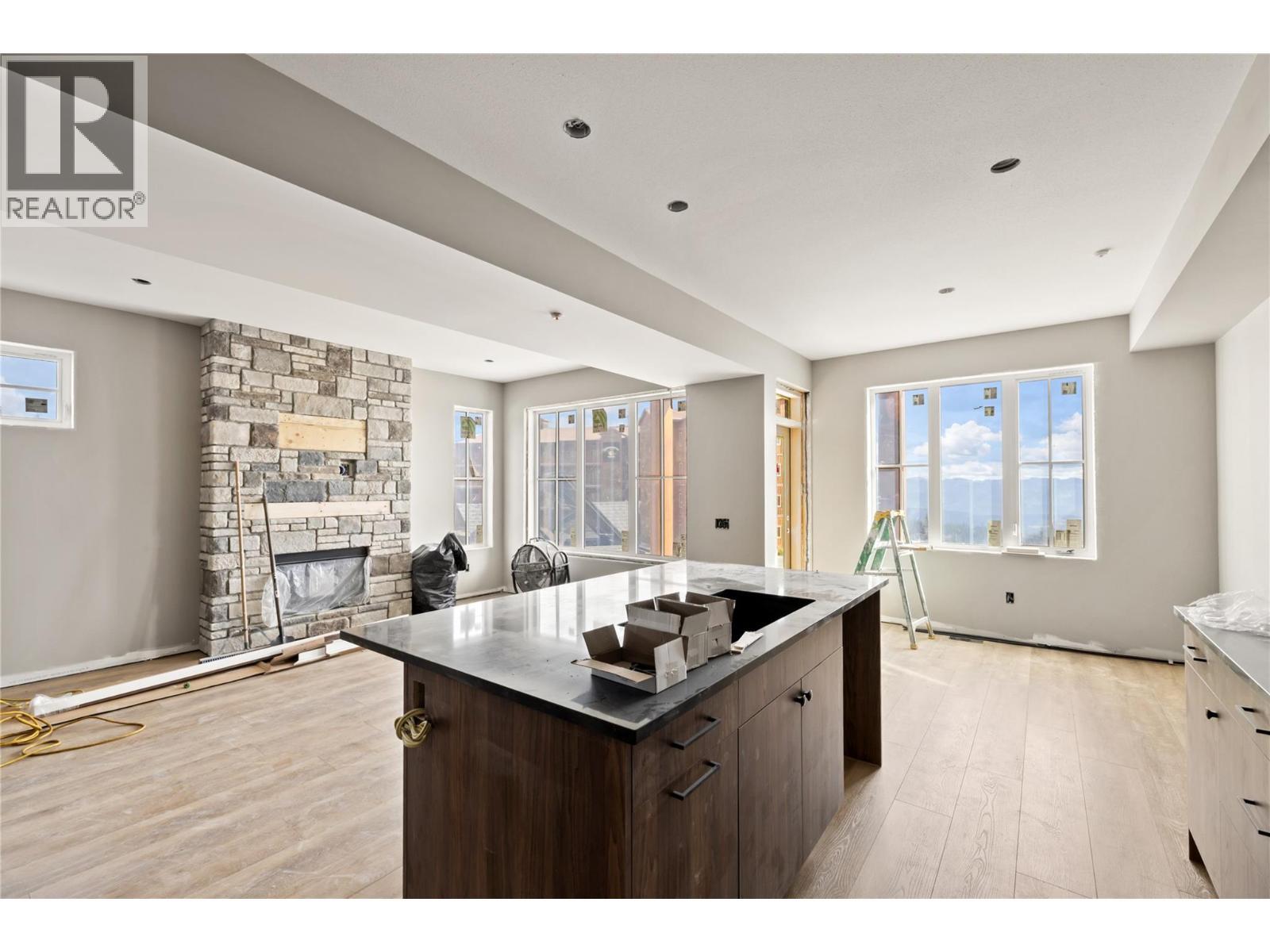 Progress update Oct 2025 (similar to unit 89) - 255 Feathertop Way Unit# 88, Big White, BC - Indoor Photo Showing Kitchen With Fireplace