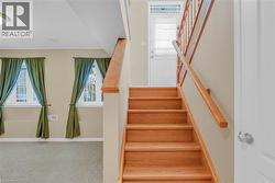 Stairs featuring carpet flooring and baseboards -