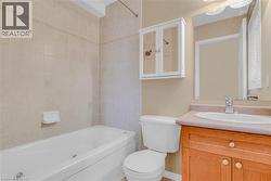 Bathroom featuring vanity and bathing tub / shower combination -