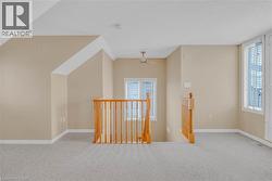 Bonus room with carpet flooring and baseboards -