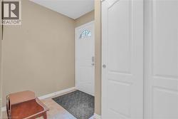 Foyer featuring baseboards -