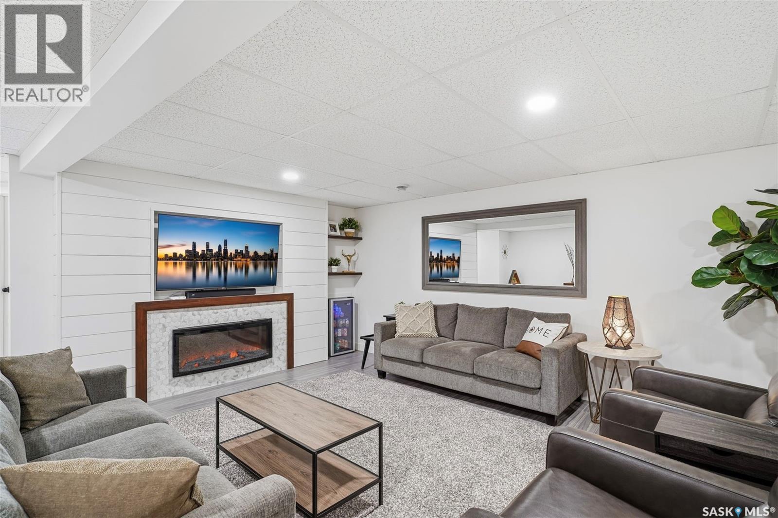 4 Barnes Crescent, Humboldt, SK - Indoor Photo Showing Living Room With Fireplace
