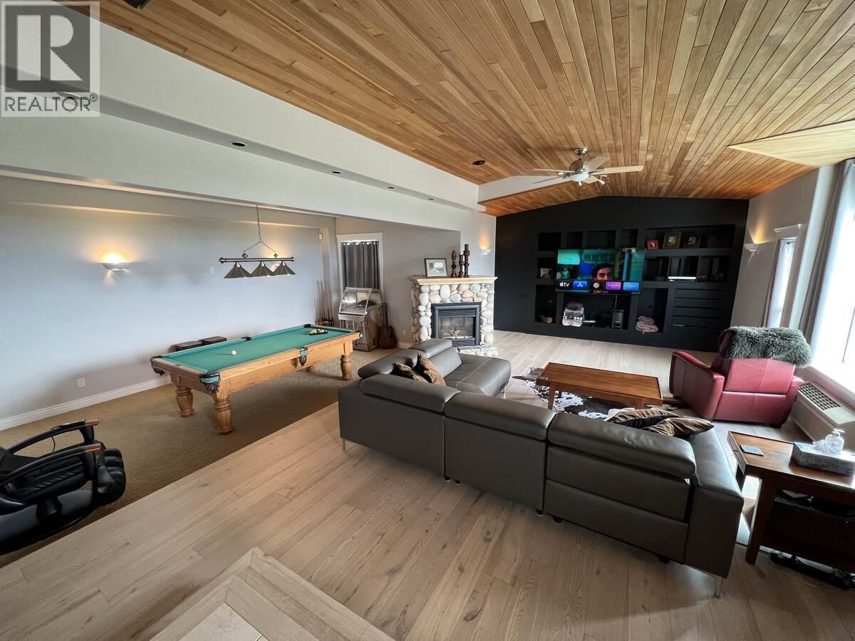 3380 Neid Road, Kelowna, BC - Indoor Photo Showing Other Room With Fireplace