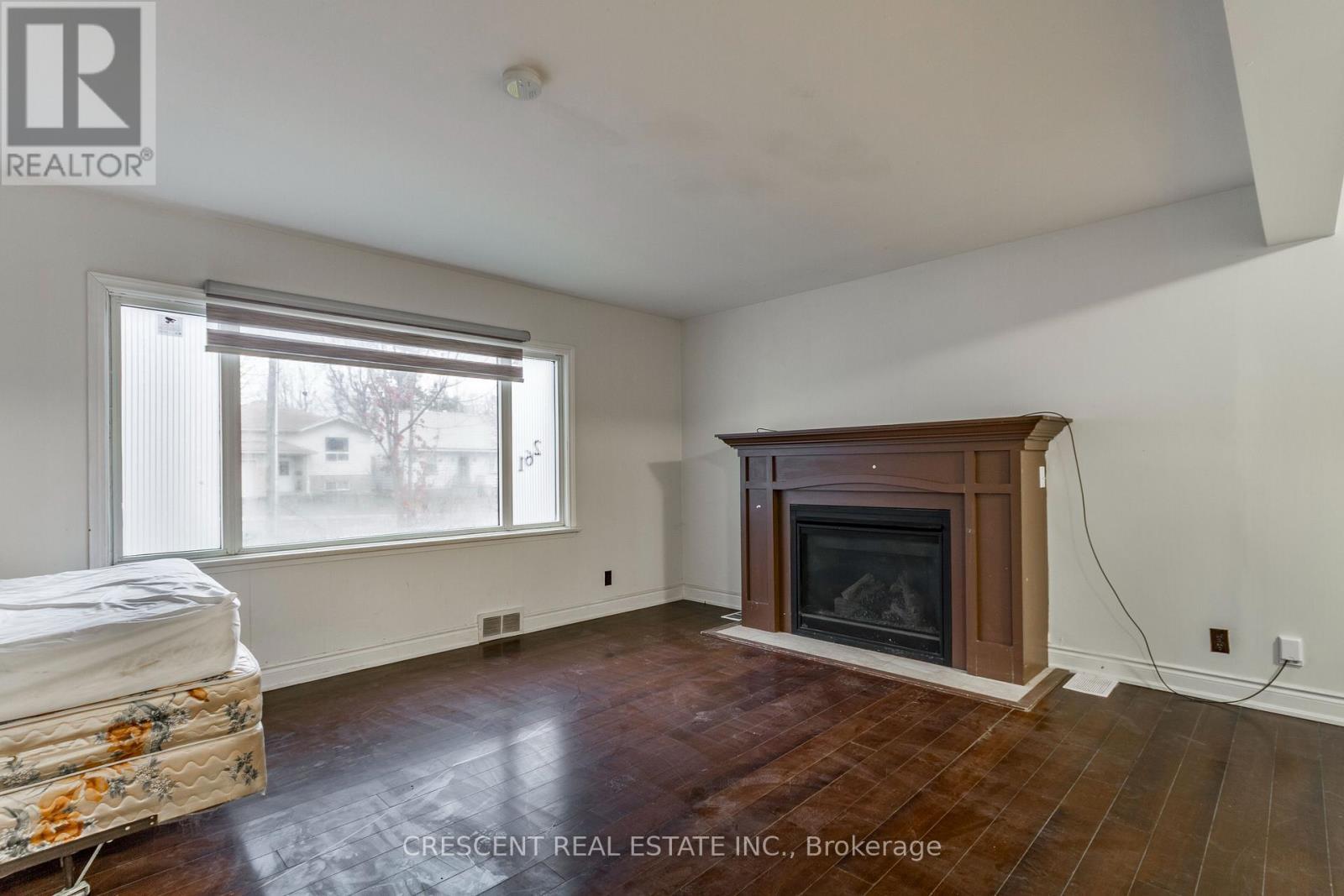 Main & Upper - 261 Barrie Road, Orillia, ON - Indoor Photo Showing Living Room With Fireplace