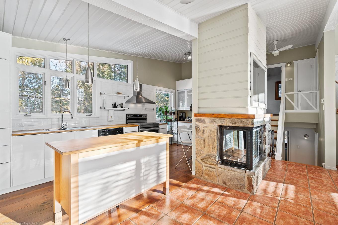 Kitchen - 1387 Rue Du Bel-Automne, Sainte-Adèle, QC - Indoor With Fireplace