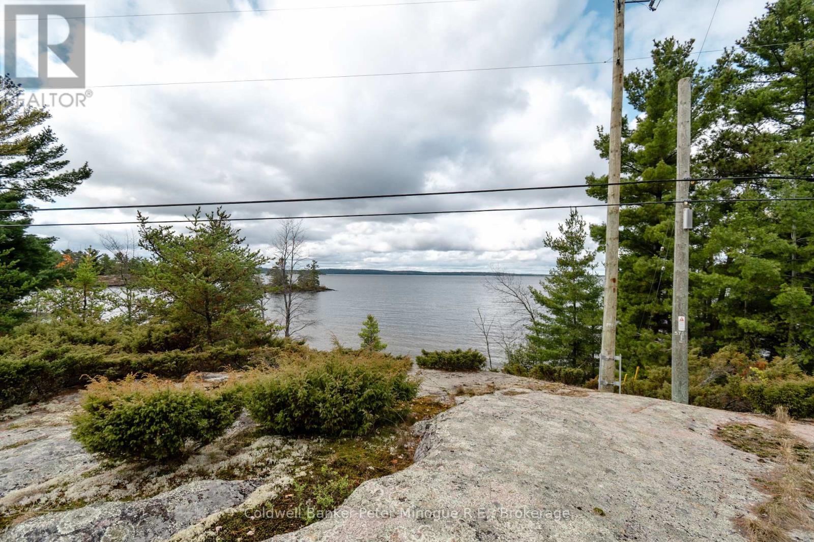 567 Sunset Cove Road, Callander, ON - Outdoor With Body Of Water With View