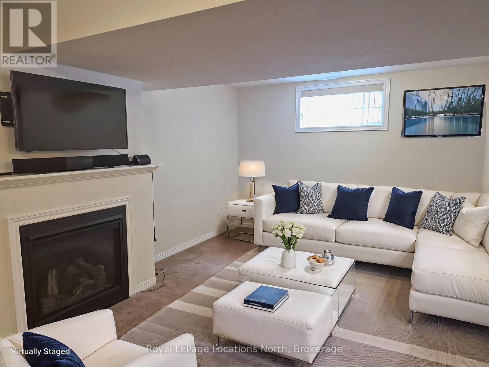 Entire Home - 27 Portland Street, Collingwood, ON - Indoor Photo Showing Living Room With Fireplace