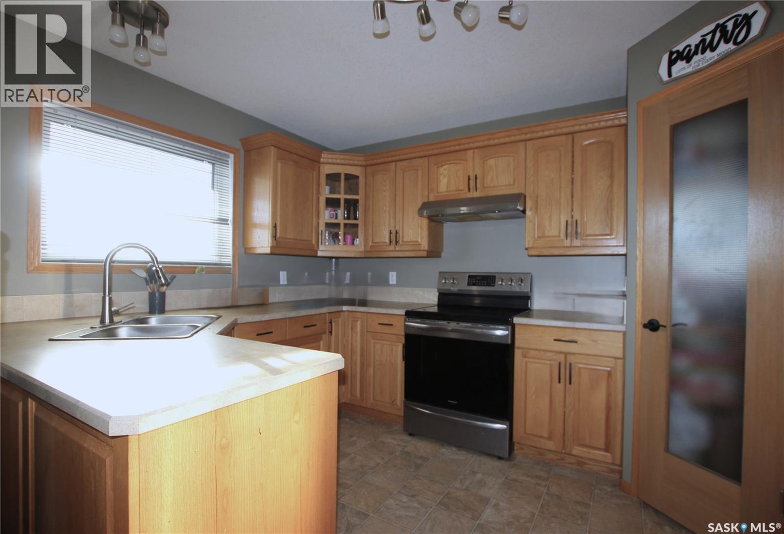49 Wilson Crescent, Yorkton, SK - Indoor Photo Showing Kitchen With Double Sink