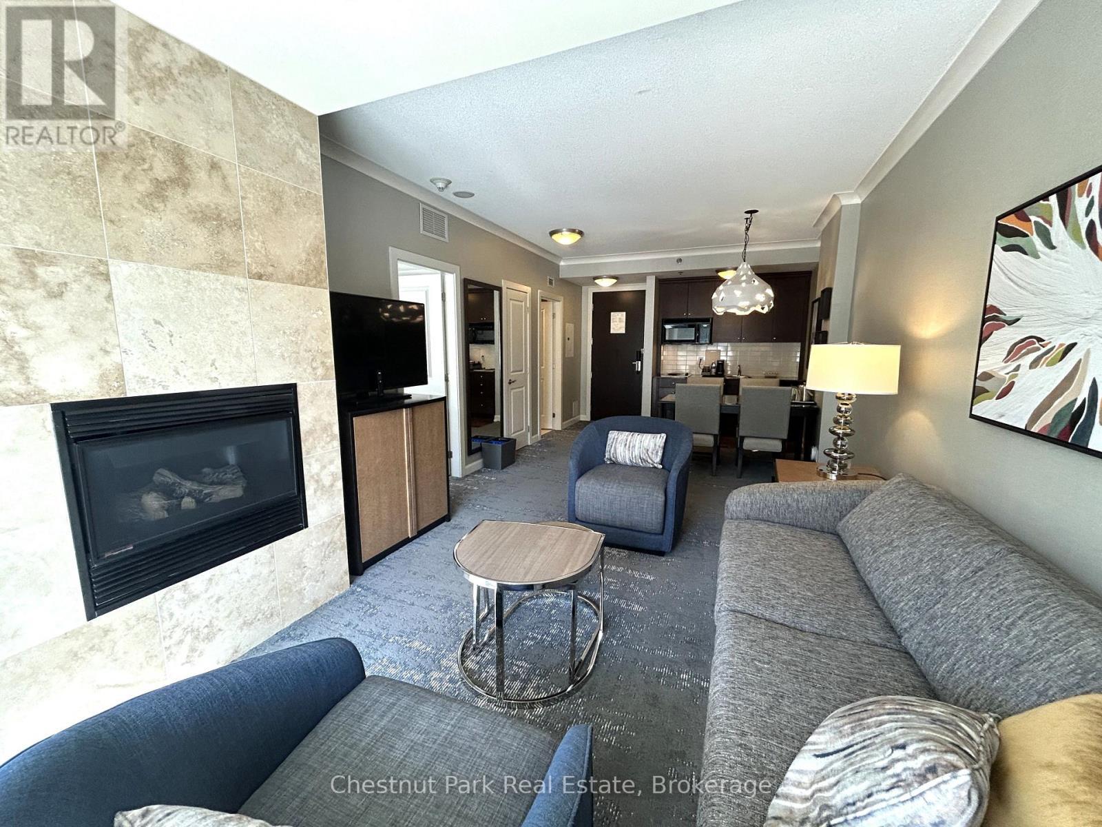 307 - 220 Gord Canning Drive, Blue Mountains, ON - Indoor Photo Showing Living Room With Fireplace