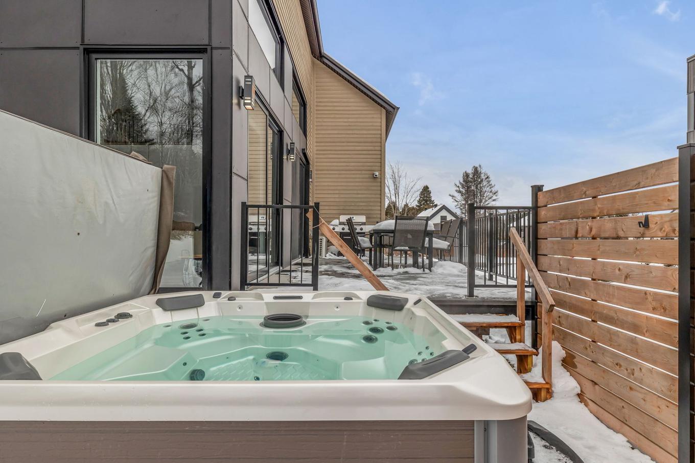 Hot tub - 38 Rue Du Refuge, Saint-Ferréol-Les-Neiges, QC - Outdoor With Exterior