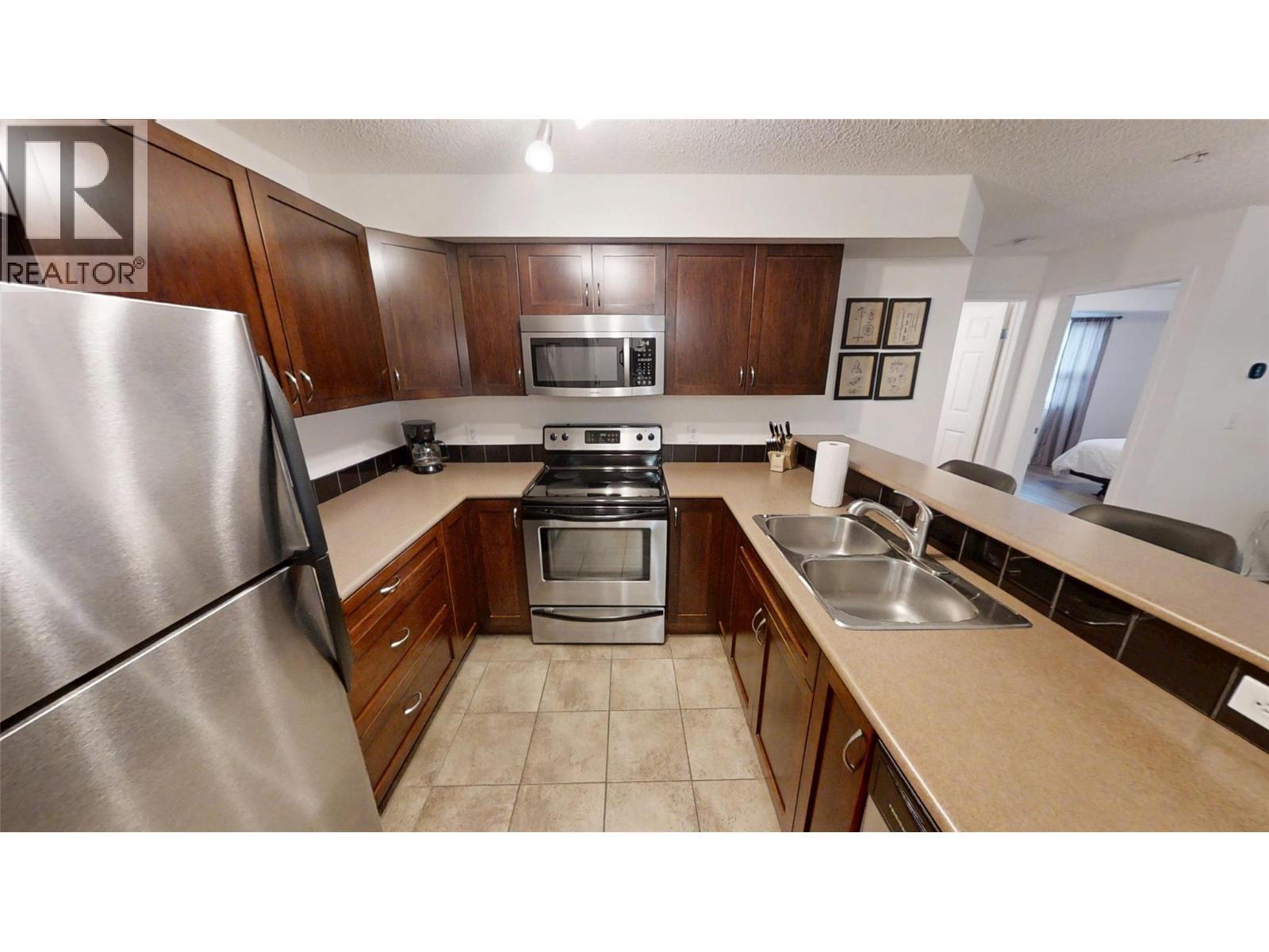 205 Third Avenue Unit# 3117, Invermere, BC - Indoor Photo Showing Kitchen With Double Sink