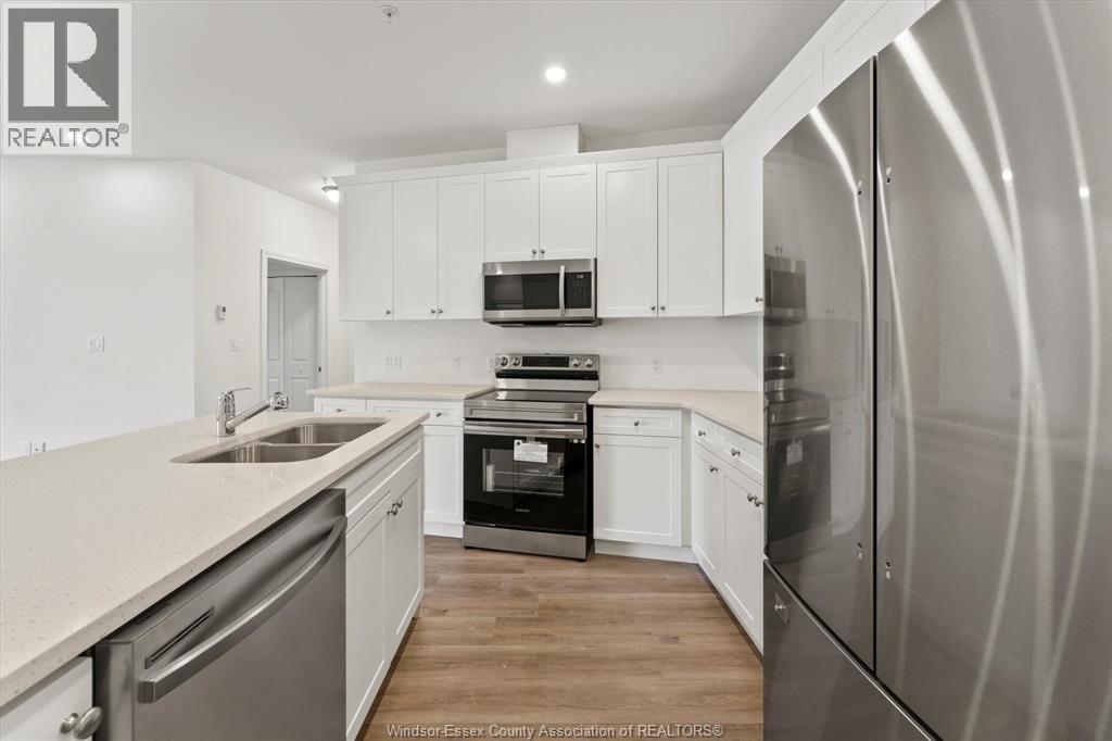 1888 Westview Park Boulevard Unit# 114, Lasalle, ON - Indoor Photo Showing Kitchen With Double Sink