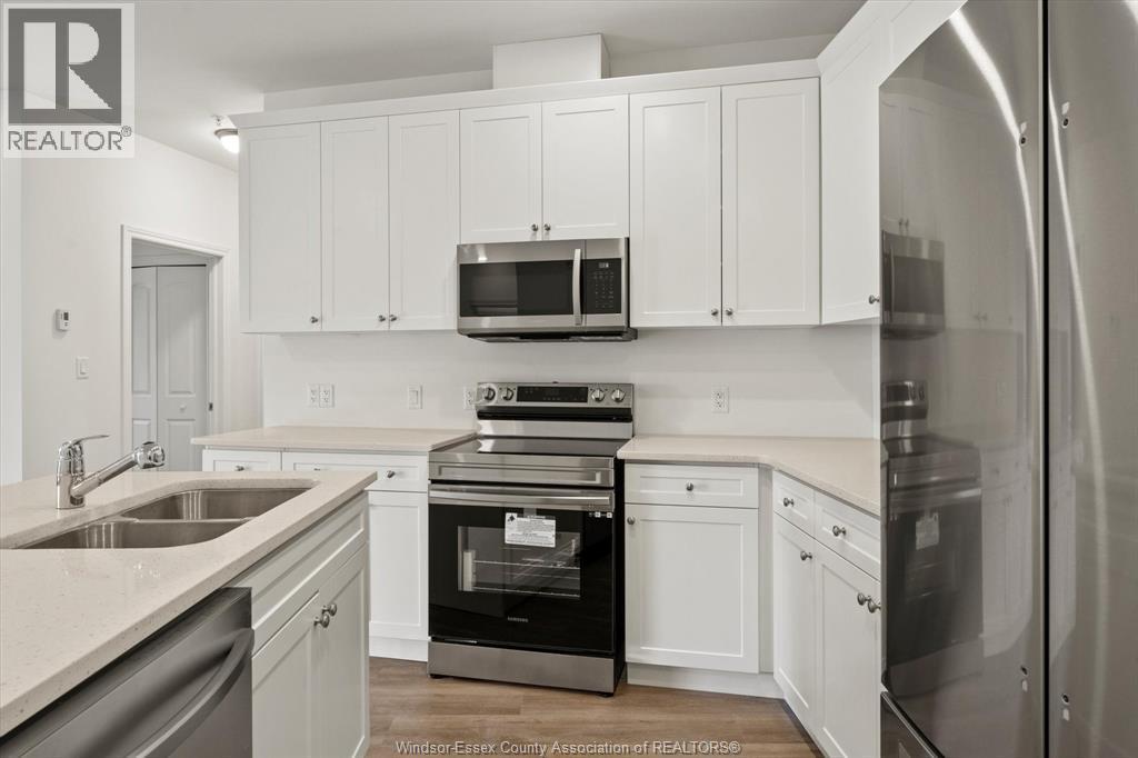 1888 Westview Park Boulevard Unit# 114, Lasalle, ON - Indoor Photo Showing Kitchen With Double Sink