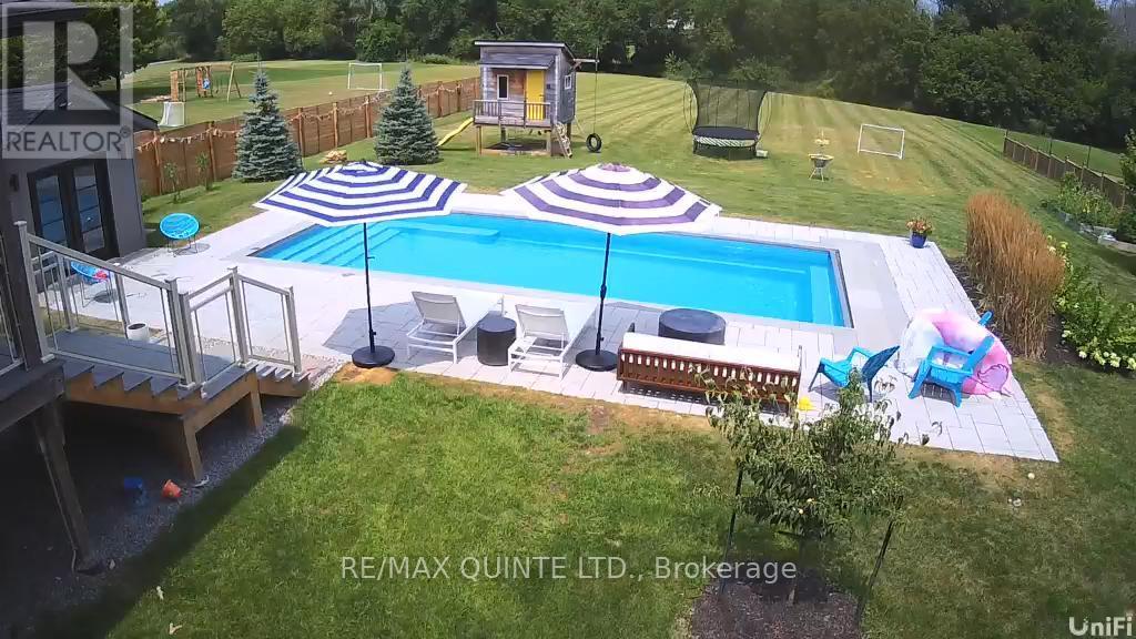 54 Settlers Landing Drive, Quinte West (Sidney Ward), ON - Outdoor With In Ground Pool With Deck Patio Veranda