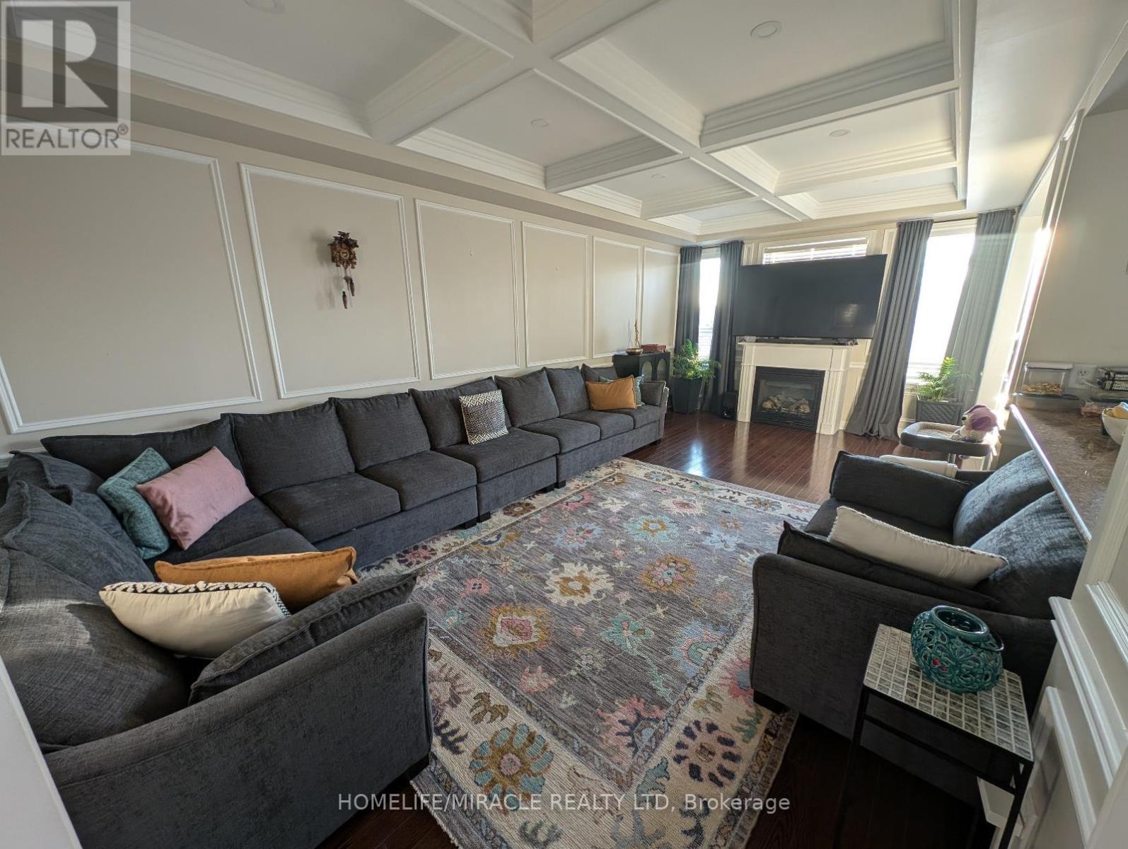 16 - 2019 Trawden Way, Oakville, ON - Indoor Photo Showing Living Room With Fireplace