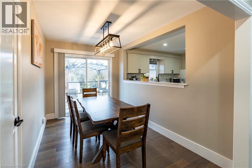 Dining area with dark wood finished floors and baseboards - 266 Melrose Avenue, Kitchener, ON - Indoor Photo Showing Dining Room