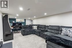 Carpeted living area with an office area -