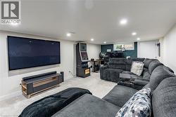 Carpeted living room featuring baseboards and recessed lighting -