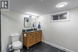 Bathroom with vanity and toilet -