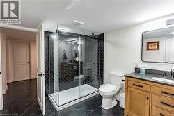 Full bathroom featuring vanity and a stall shower -