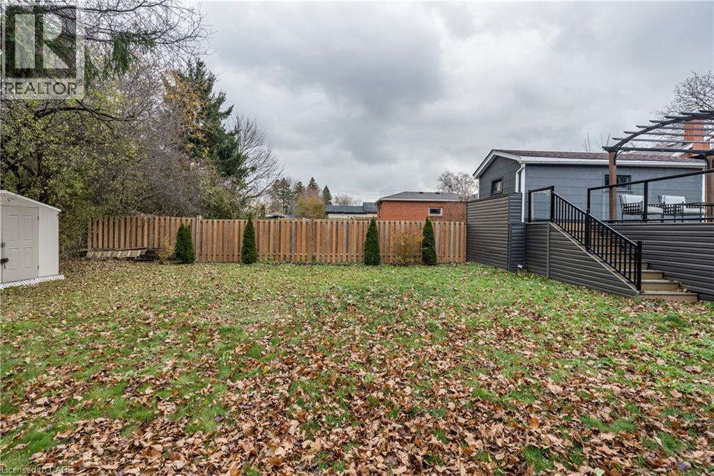 View of yard featuring stairs, a deck, and a storage shed - 266 Melrose Avenue, Kitchener, ON - Outdoor