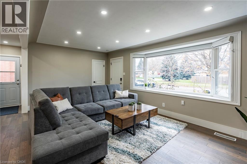 Living area with wood-type flooring, recessed lighting, and plenty of natural light - 266 Melrose Avenue, Kitchener, ON - Indoor Photo Showing Living Room