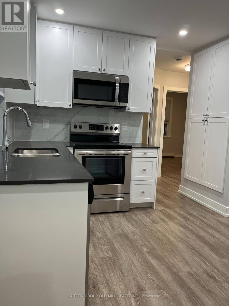 Main Floor - 97 Twelfth Street, Toronto, ON - Indoor Photo Showing Kitchen With Double Sink