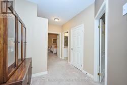 Main level primary bedroom overlooks the ravine -