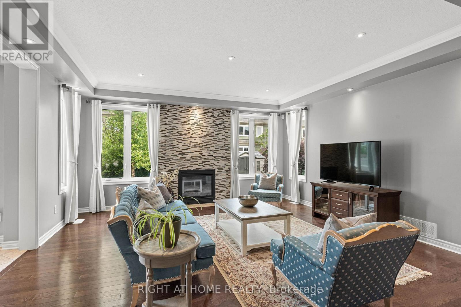 2209 Sunset Cove Circle, Ottawa, ON - Indoor Photo Showing Living Room With Fireplace