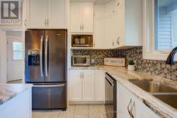 Updated appliances with soft close cabinetry -