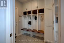 Mudroom off garage with organizational built-ins -