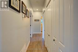 Hallway to bedrooms & baths & main floor laundry -