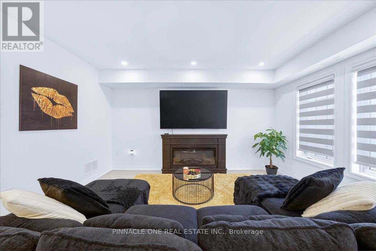 4 - 41 Pumpkin Corner Crescent, Barrie, ON - Indoor Photo Showing Living Room With Fireplace