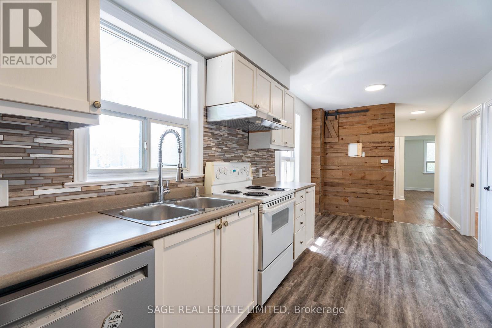 3 - 16 Simpson Avenue, Toronto, ON - Indoor Photo Showing Kitchen With Double Sink