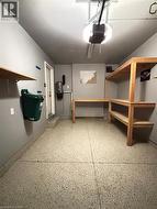 Garage with a garage door opener and a central vacuum unit -