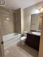 Bathroom featuring shower / bathtub combination and vanity -