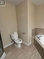 Bathroom with a garden tub and a stall shower -