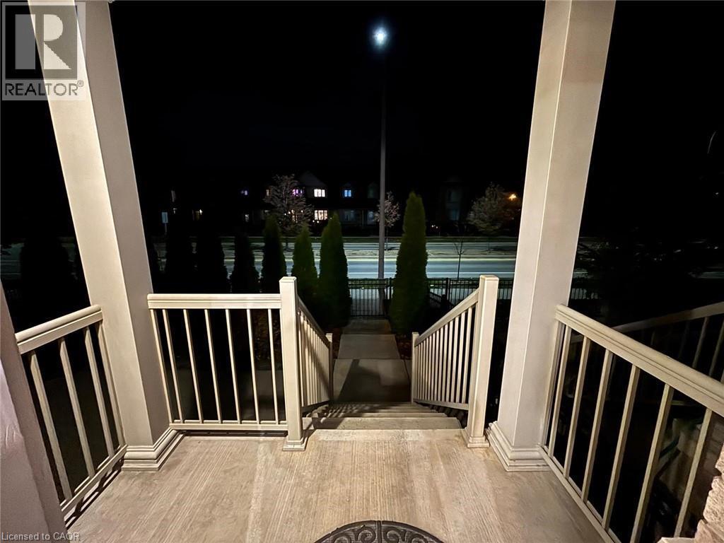 View of balcony at twilight - 6 Chestnut Drive Unit# 16, Grimsby, ON - Outdoor With Exterior