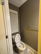 Bathroom with baseboards and tile patterned floors -