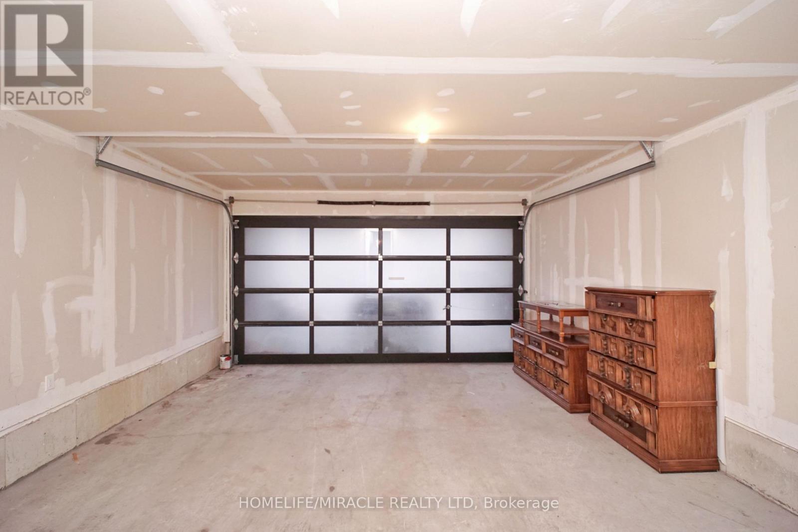 59 Sorbara Way, Whitby, ON - Indoor Photo Showing Garage