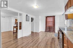 eat-in kitchen w laundry open to living room -