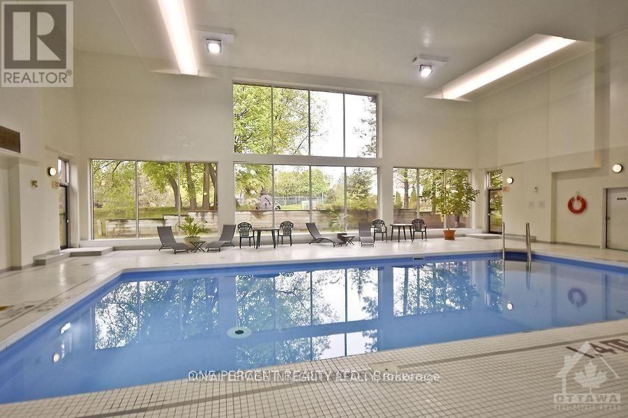 Indoor Swimming Pool - 406 - 270 Brittany Drive, Ottawa, ON - Indoor Photo Showing Other Room With In Ground Pool