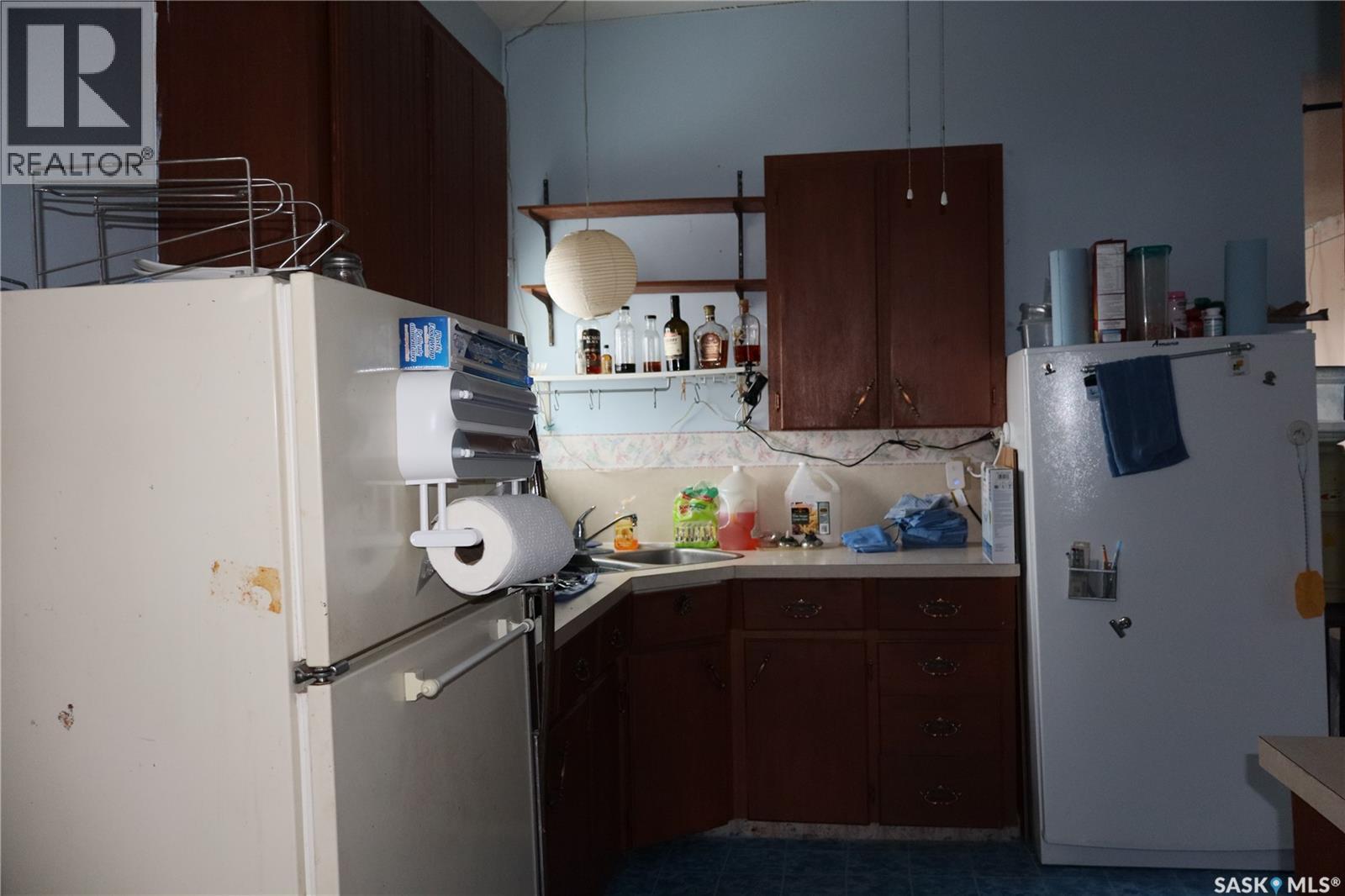 210 1St Avenue, Sutton Rm No. 103, SK - Indoor Photo Showing Kitchen With Double Sink