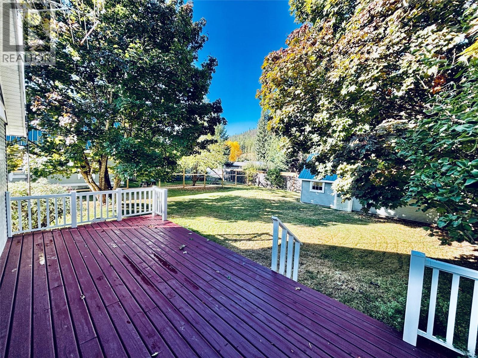 Deck to Backyard - 501 Arthur Street, Slocan, BC - Outdoor With Deck Patio Veranda