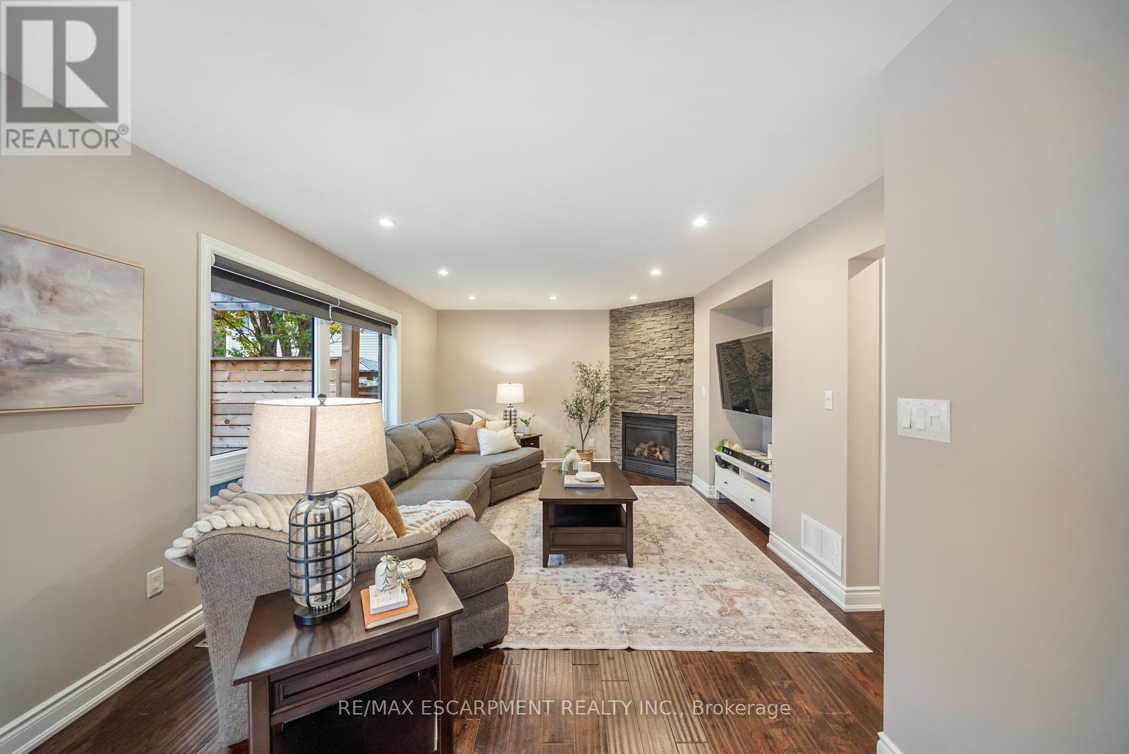1351 Mcguffin Gate, Milton, ON - Indoor Photo Showing Living Room With Fireplace